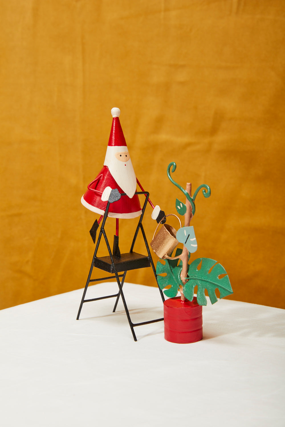 Plant Care Santa Figurine